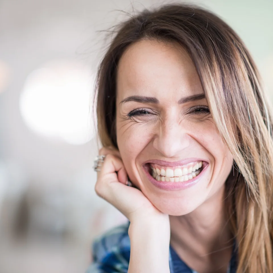 Portrait of cheerful smiling woman, toned image