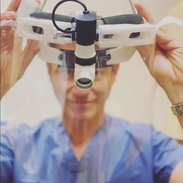 Physician preparing a medical headlamp